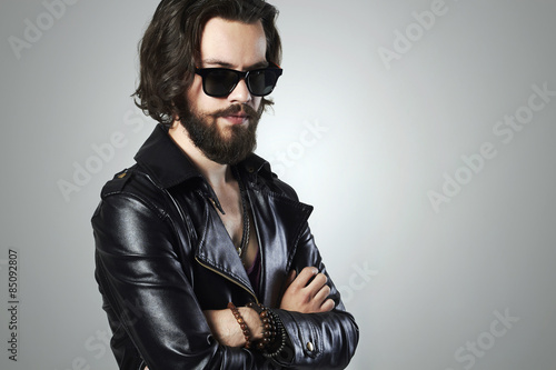 handsome man in leather.Brutal bearded Sexy boy in sunglasses