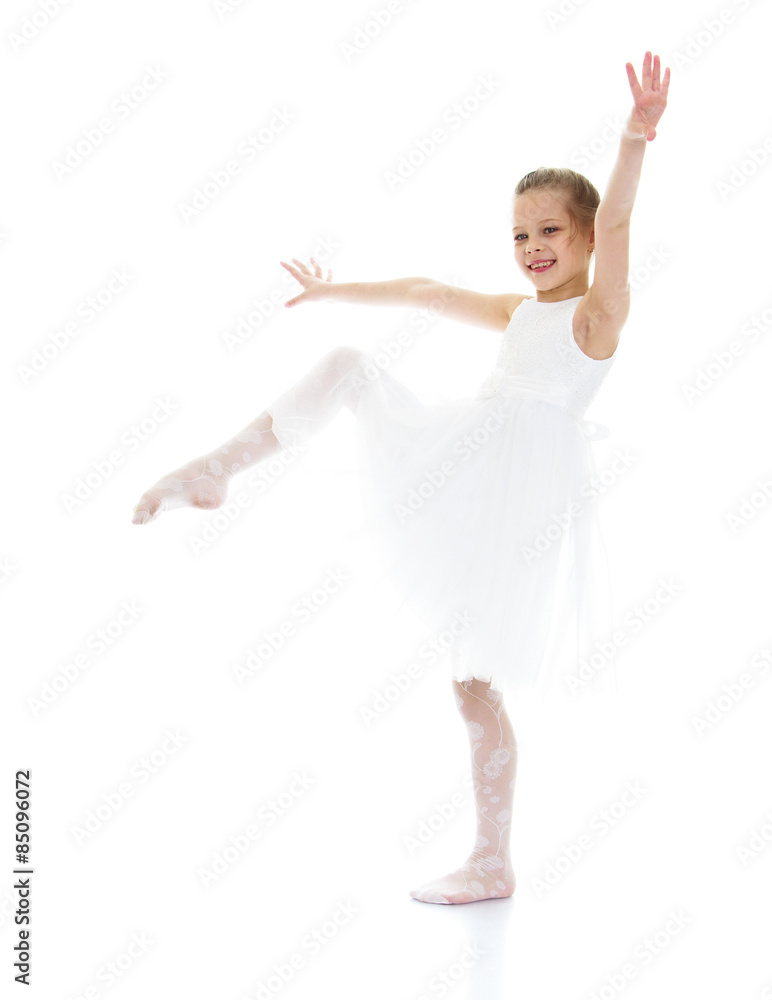 Ballerina child raised her leg up and pulling sock