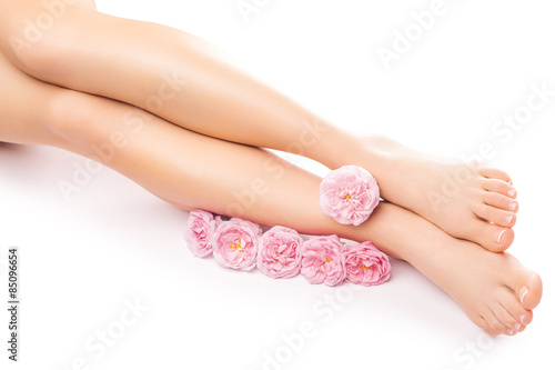 Relaxing pedicure with a pink rose flower