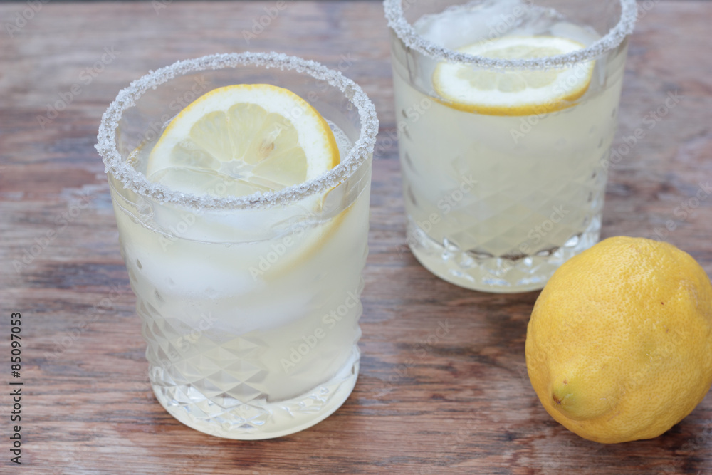Glass of freshly prepared, cold and refreshing lemonade. Glass of freshly prepared, cold and refreshing lemonade.