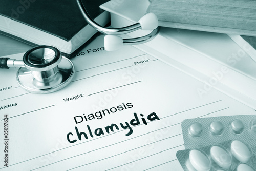Diagnostic form with diagnosis chlamydia and pills. photo