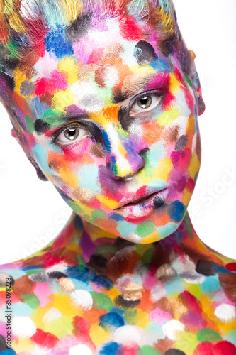 Fototapeta Naklejka Na Ścianę i Meble -  Girl with colored face painted. Art beauty image.