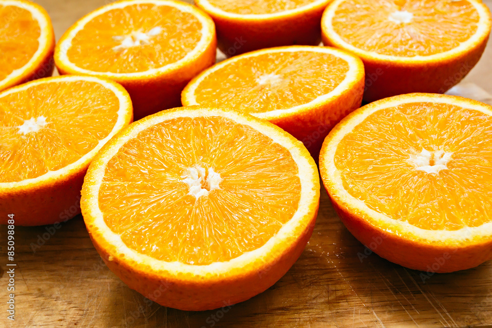 Fototapeta premium Oranges cut set on wood