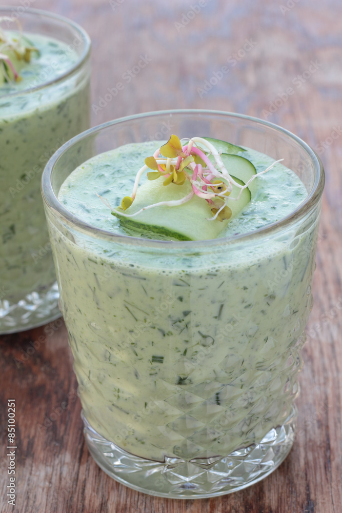 Closeup of glasses of cold cucumber and dill soup. Closeup of glasses of cold cucumber and dill soup.