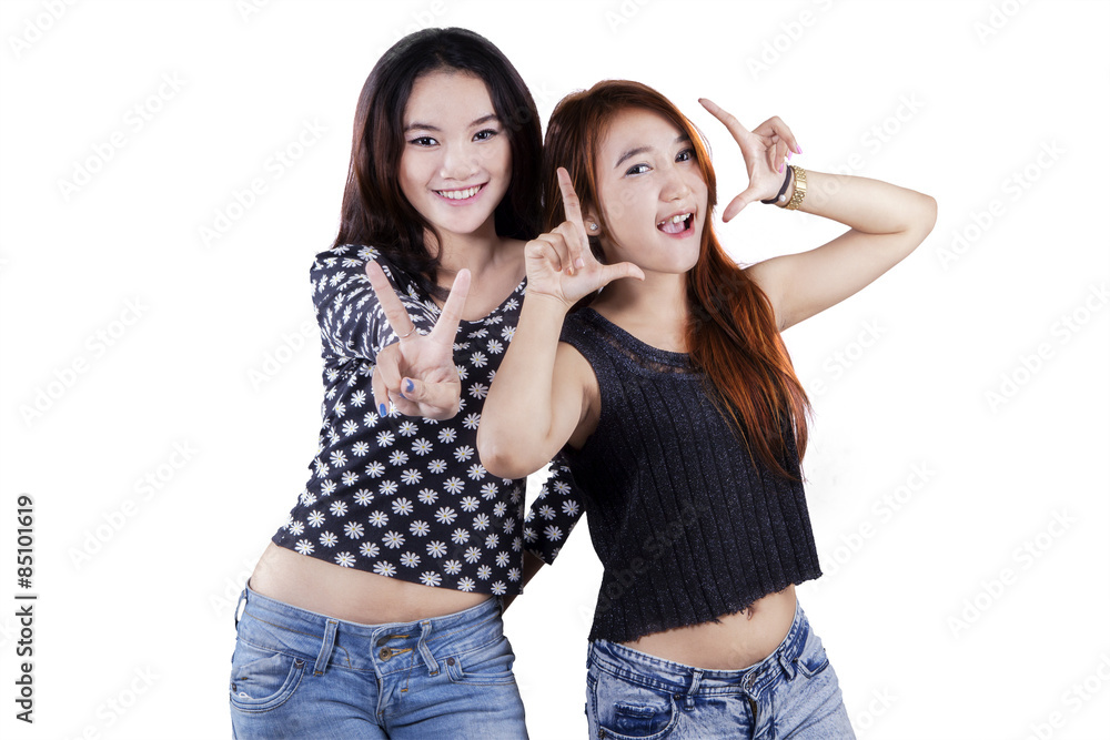 Two teenage girls having fun in studio Two teenage girls having fun in studio
