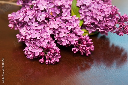 beautiful cut lilac flowers laying on a table