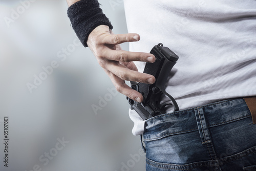 Man grabbing his pistol