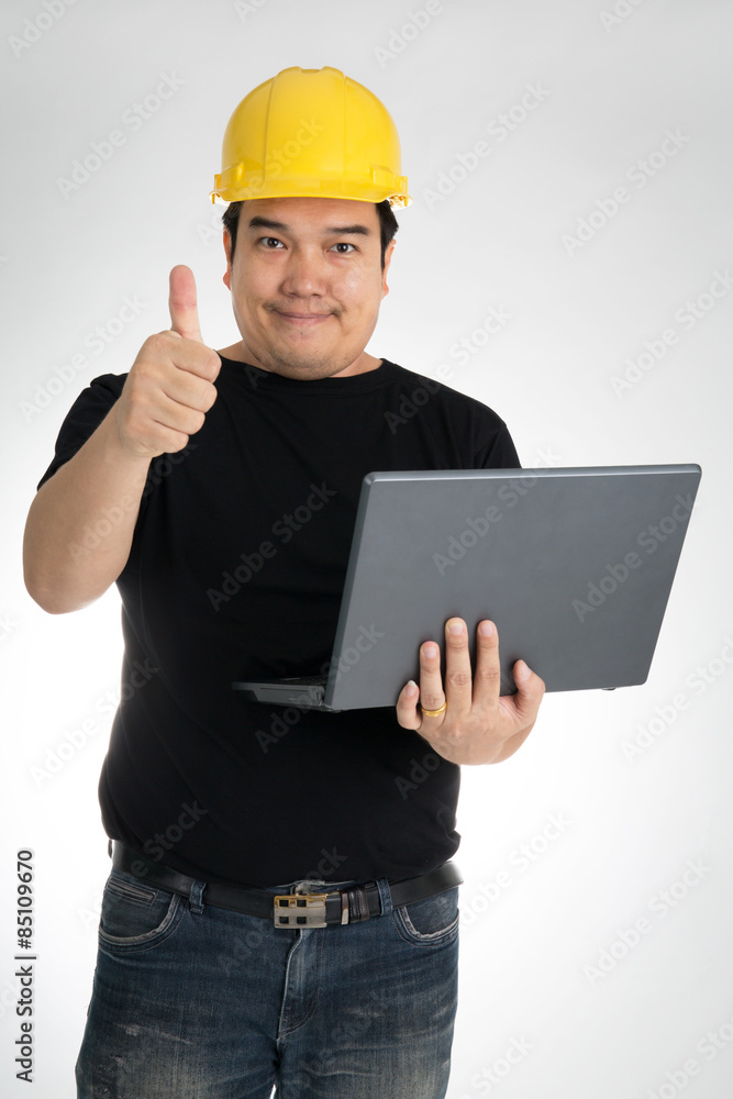 Engineer checking on production on laptop Engineer checking on production on laptop
