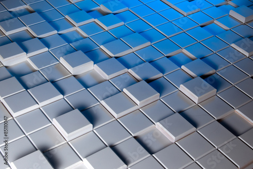 White and blue background of regularly shaped wooden blocks