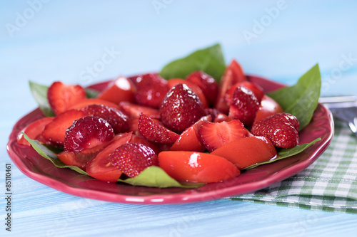 Salad with strawberries and tomatoes.