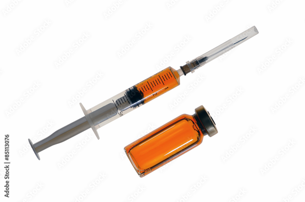Fototapeta premium Plastic disposable syringe with medicine and a glass bubble with