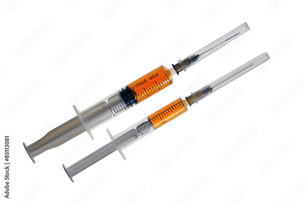 Fototapeta premium Two plastic disposable syringes with a needles in a protective c