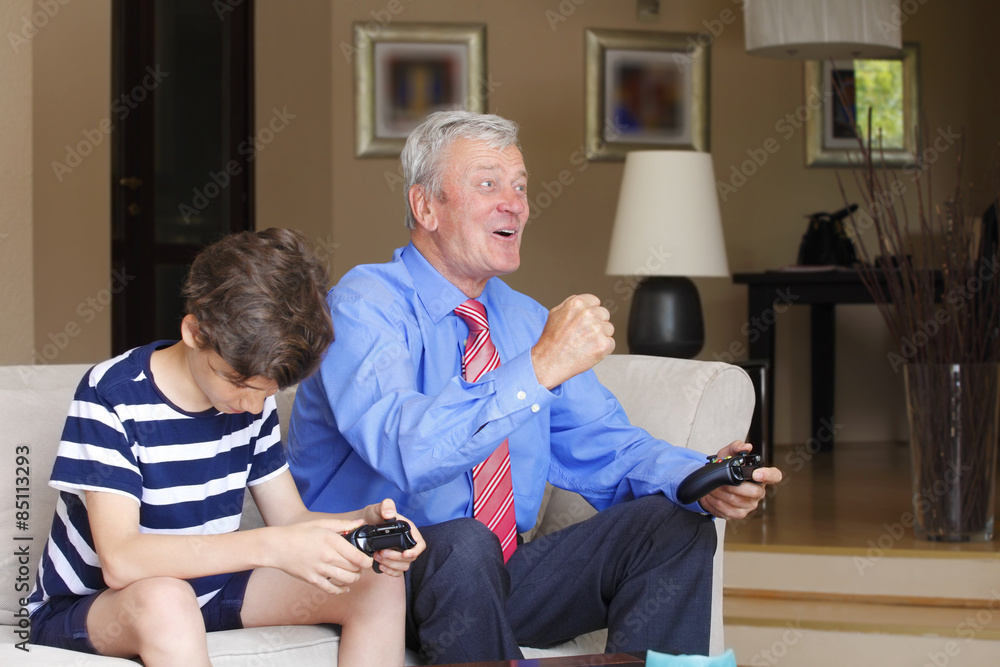 Obraz premium Grandfather and grandson playing together