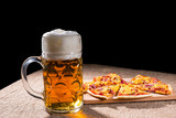 Mug of Beer and Slices of Pizza on Cutting Board