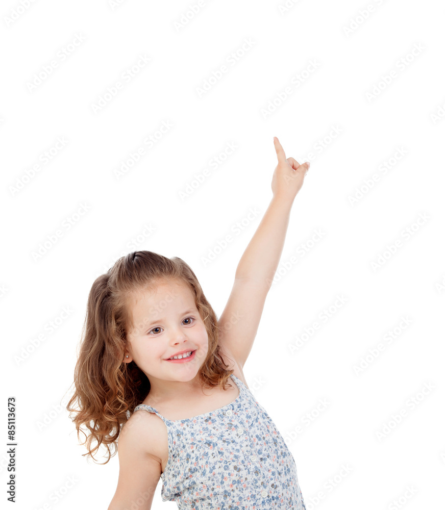 Happy little girl indicating something with the finger Happy little girl indicating something with the finger