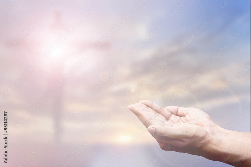 Praying Hand and the cross blurred background Praying Hand and the cross blurred background