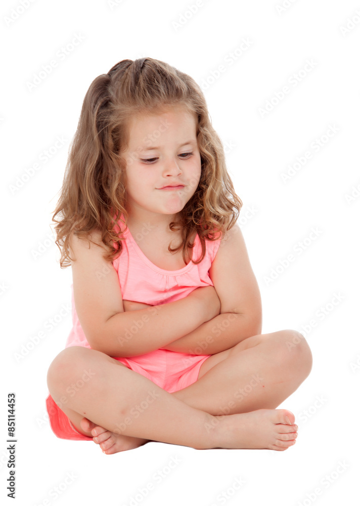 Angry little girl with three year old sitting on the floor Angry little girl with three year old sitting on the floor