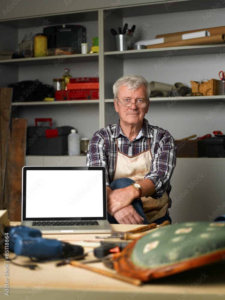 Retired carpenter with laptop Retired carpenter with laptop
