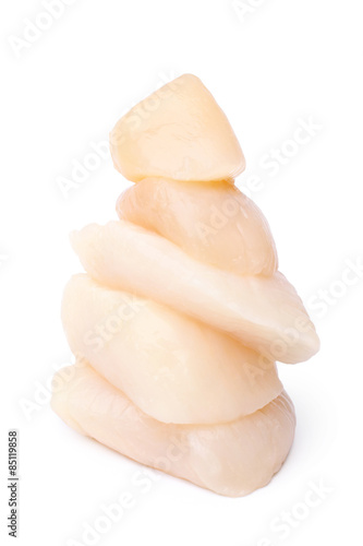 Stack of peeled raw scallops