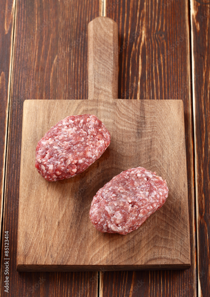 ground meat on a wooden background ground meat on a wooden background