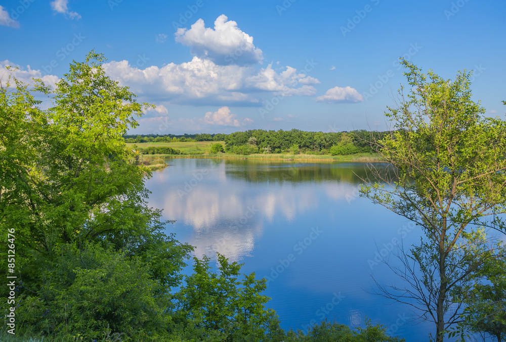 Calm beautiful rural landscape with a lake Calm beautiful rural landscape with a lake