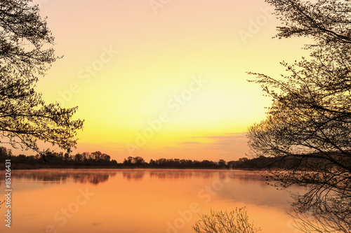 Serene Sunrise at the Lake in Bavaria, Germany. Lovely warm spring morning