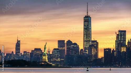 Timelapse with Lower Manhattan, Freedom Tower and The Statue of Liberty at sunrise