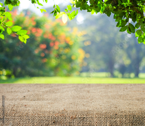 Empty table and sack tablecloth over blur tree background, for product  display montage Stock Photo | Adobe Stock