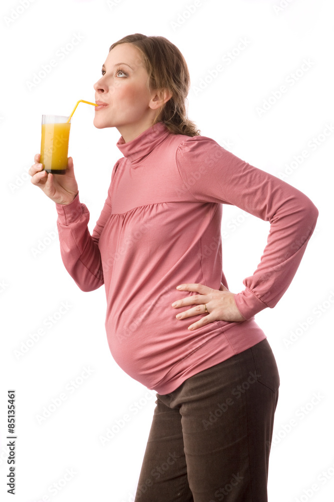 Pregnant women with the glass of juice and orange Pregnant women with the glass of juice and orange