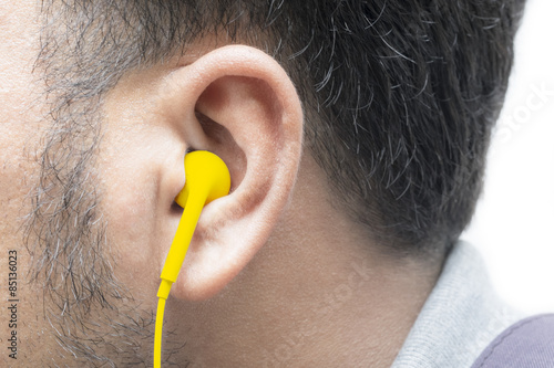 Εκτύπωση καμβά Man listening  on an ear