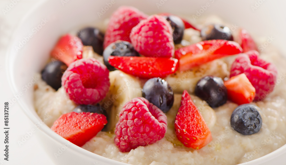 Fototapeta premium Oatmeal porridge with Berries for Healthy Breakfast.