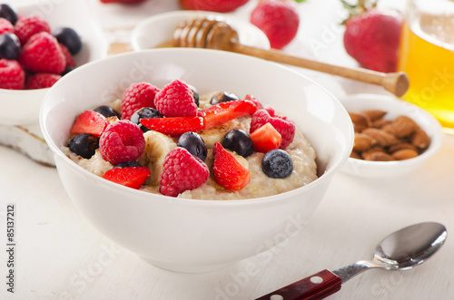 Oatmeal porridge with fresh Berries for Healthy Breakfast.