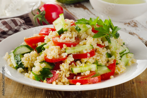 Salad with bulgur, parsley and vegetables.