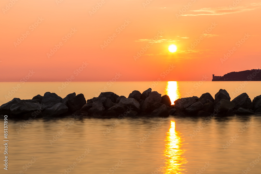 sunset behind the castle of Trieste sunset behind the castle of Trieste