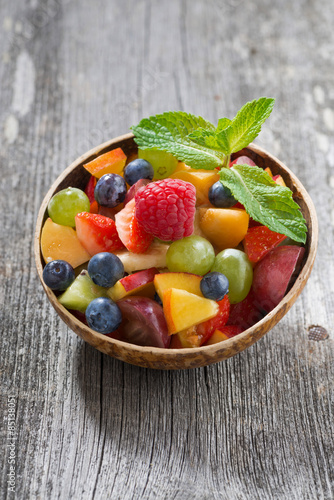 fruit salad in a bamboo bowl  vertical