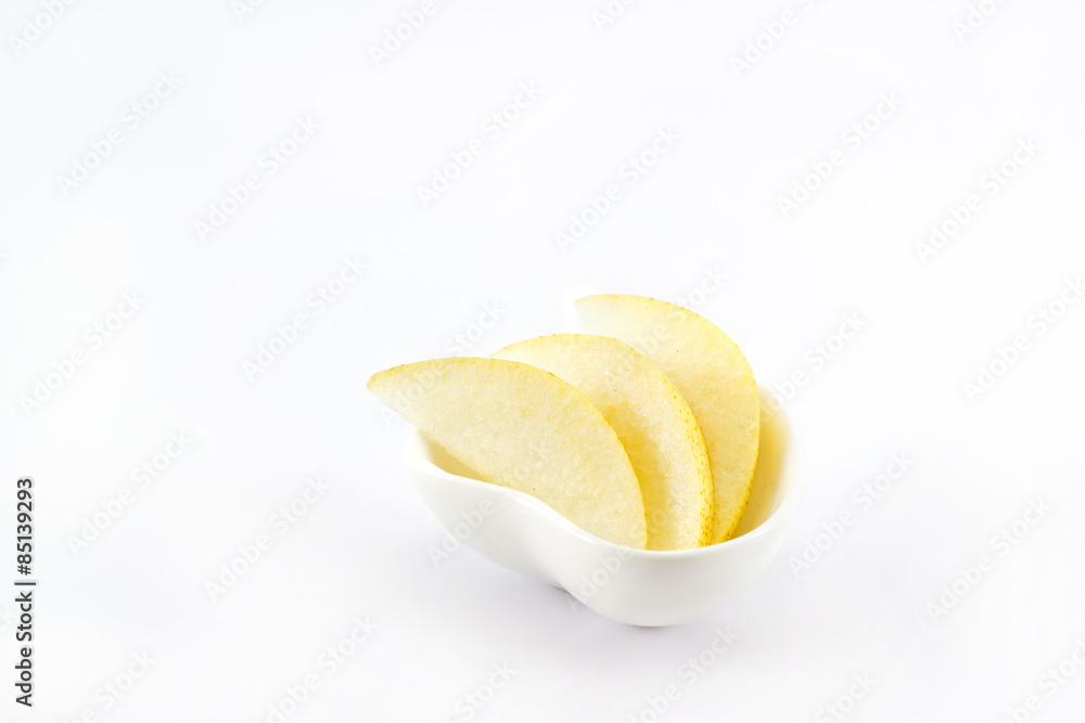 Asian pear slice in heart shape bowl on white background Asian pear slice in heart shape bowl on white background