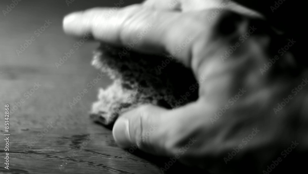 Male hand with a piece of bread. Male hand with a piece of bread.