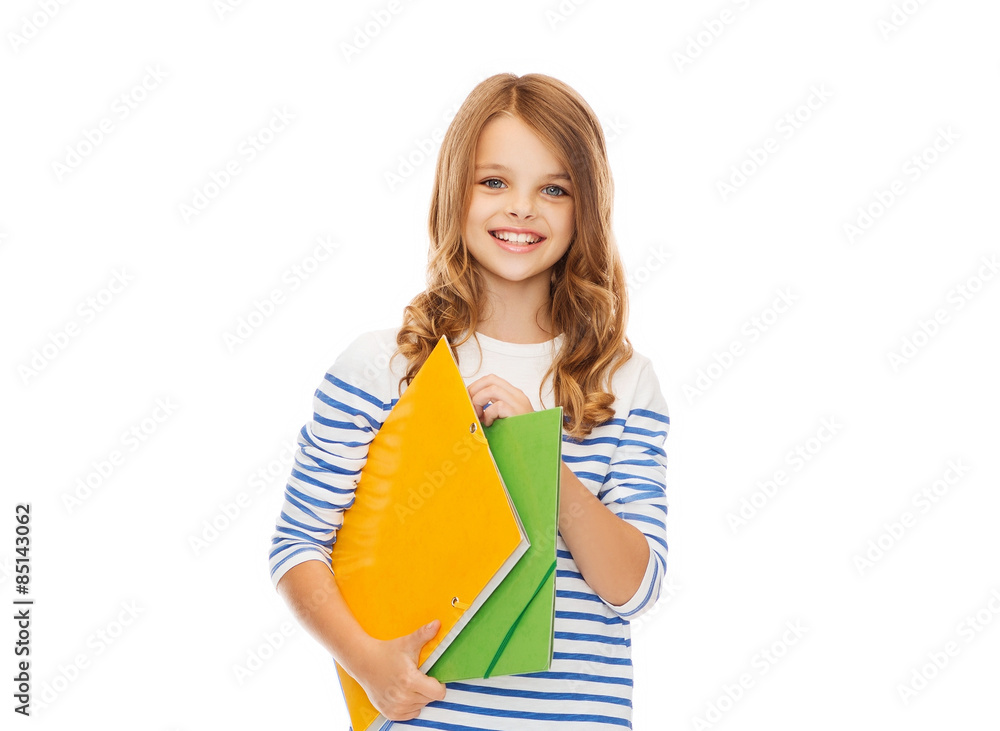 child holding colorful folders child holding colorful folders