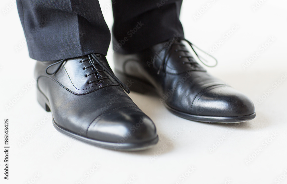 close up of man legs in elegant shoes with laces