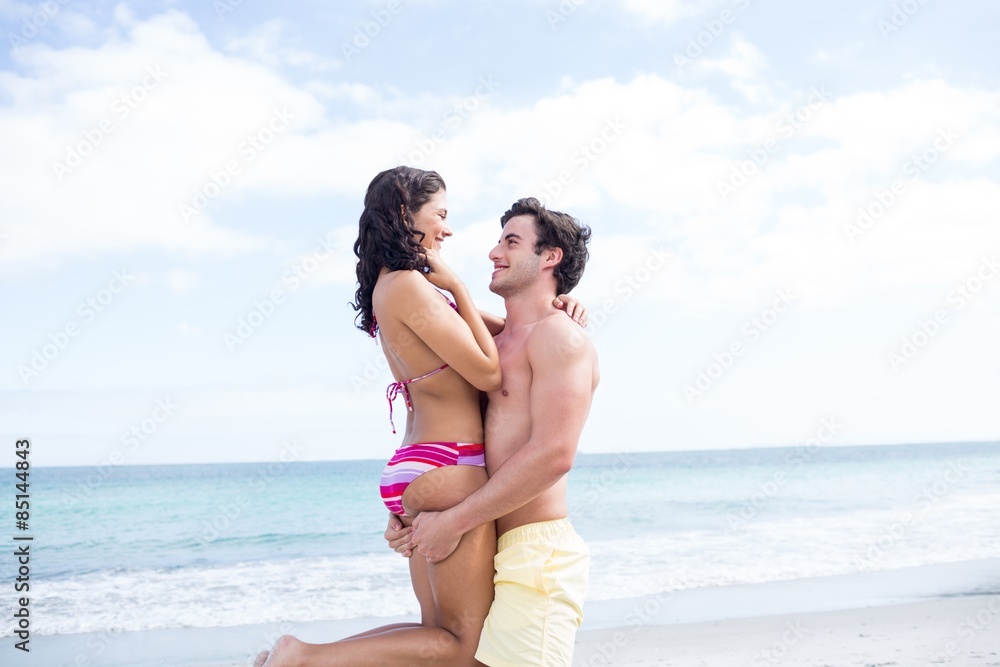 Happy couple hugging and looking at each other Happy couple hugging and looking at each other
