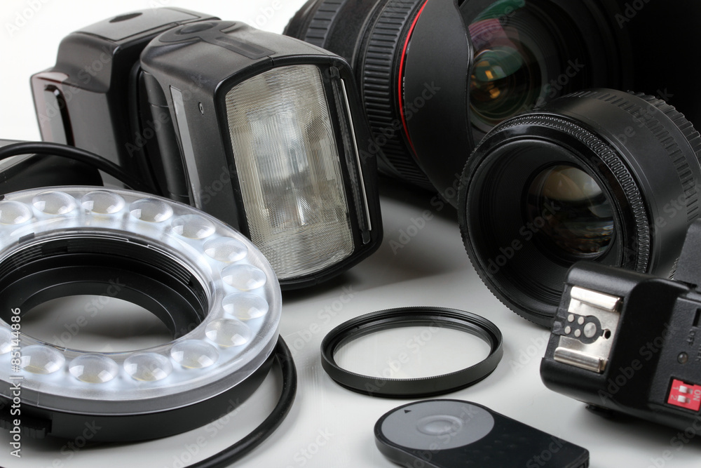 photo lenses and equipment on white background
