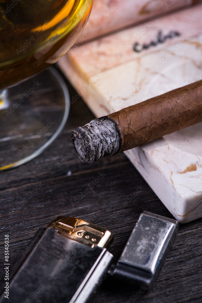 Cuban cigar in expensive marble ashtray Cuban cigar in expensive marble ashtray