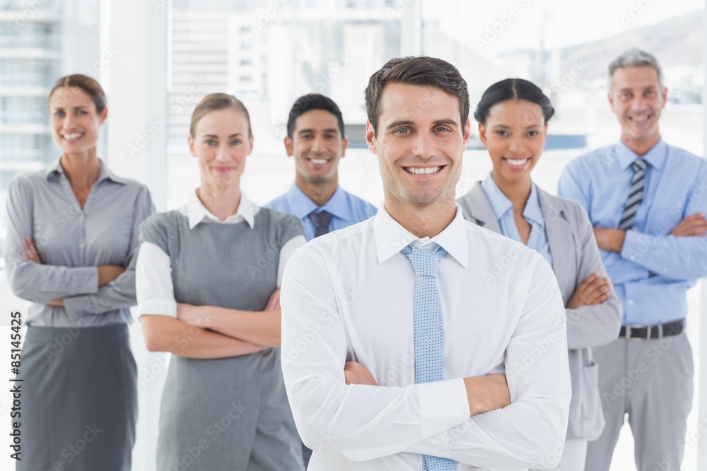 Business people looking at camera with arms crossed Business people looking at camera with arms crossed