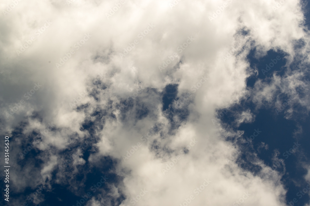 Wispy White Clouds Against Dark Blue Sky Wispy White Clouds Against Dark Blue Sky