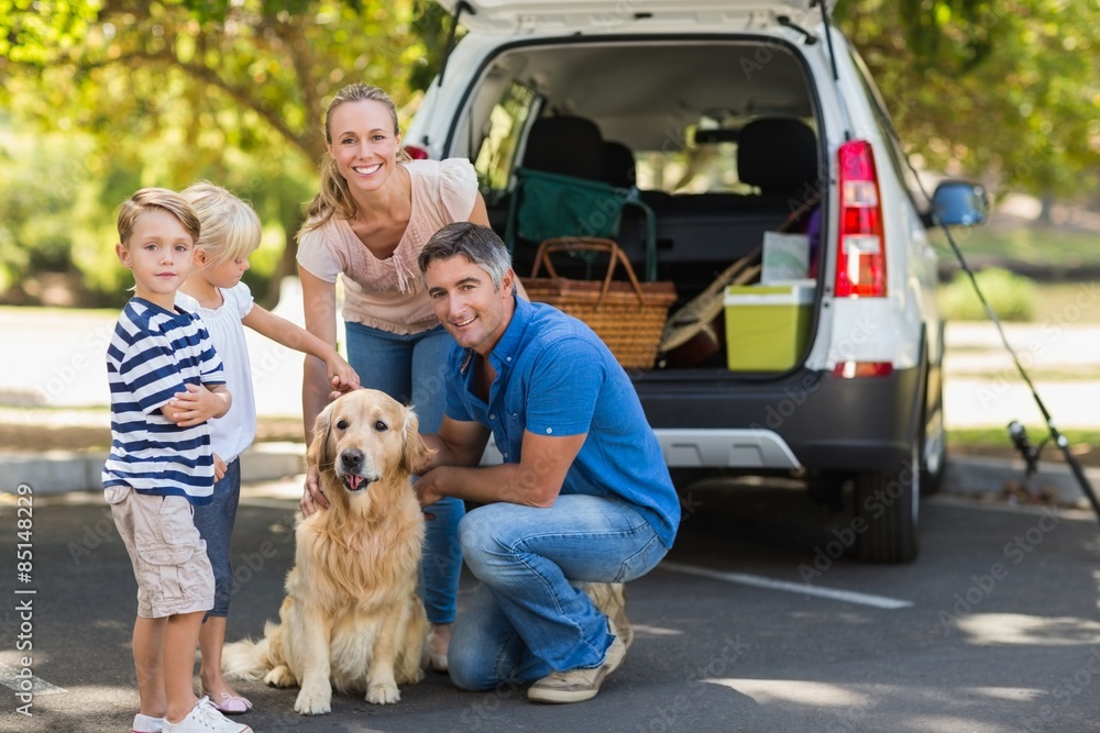 Happy family with their dog in the park Happy family with their dog in the park