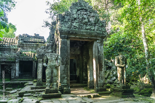 statues decapitated and entry in ruins to the archaeological enclosure of preah khan, siam reap, cambodia