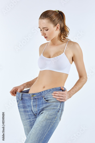 Woman became skinny and wearing old jeans