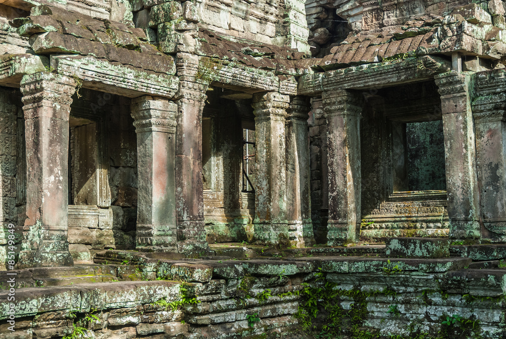 windows and pillars of a gallery in a building in ruins in the archaeological enclosure of preah khan, siam reap, cambodia