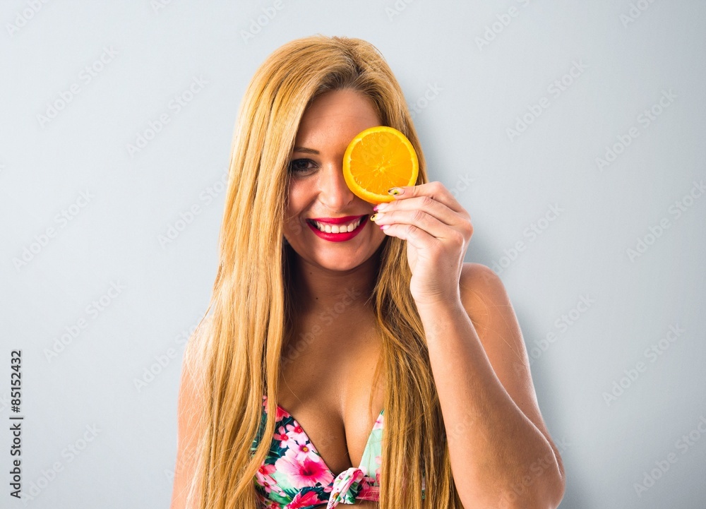 Young woman with orange slice Young woman with orange slice
