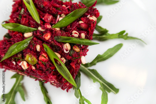 uncooked vegetarian salad with beetroot and greensprouting seed photo